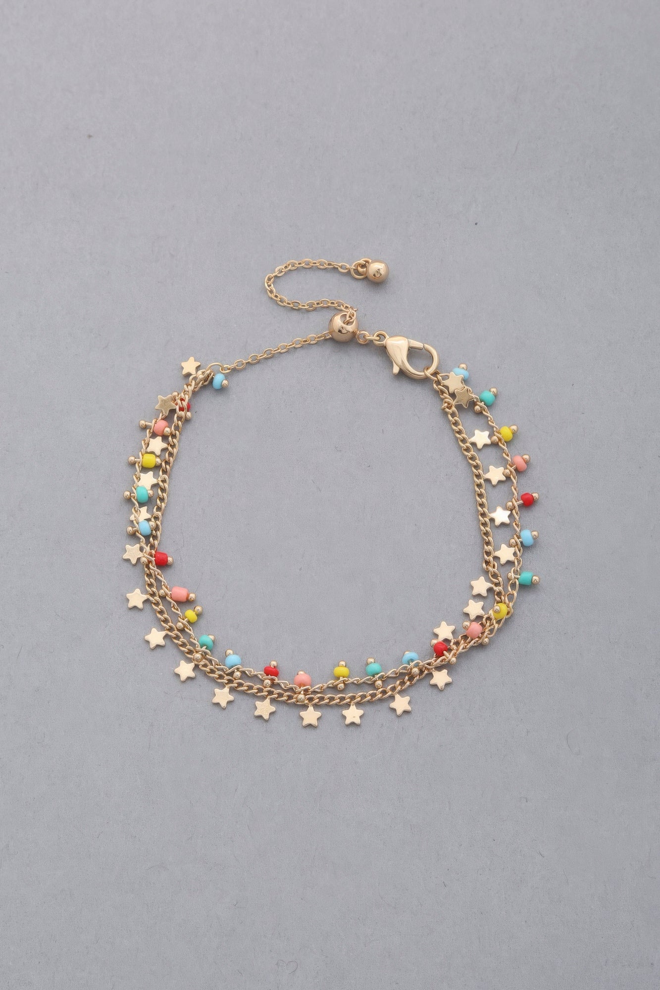 Pulsera colgante con cuentas y dije de estrella delicada