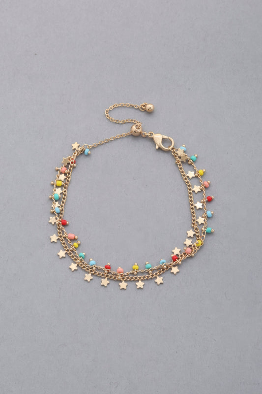 Pulsera colgante con cuentas y dije de estrella delicada