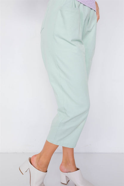 Pantalones de cintura con broche ajustable y pierna ancha con tobillo liso y elegante en colores pastel