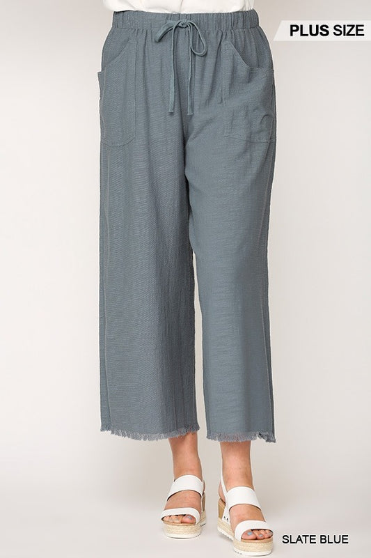 Pantalones anchos deshilachados con bolsillos